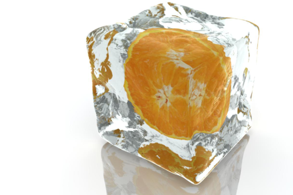 Glaçon en 3D avec une tranche d’orange figée à l’intérieur.